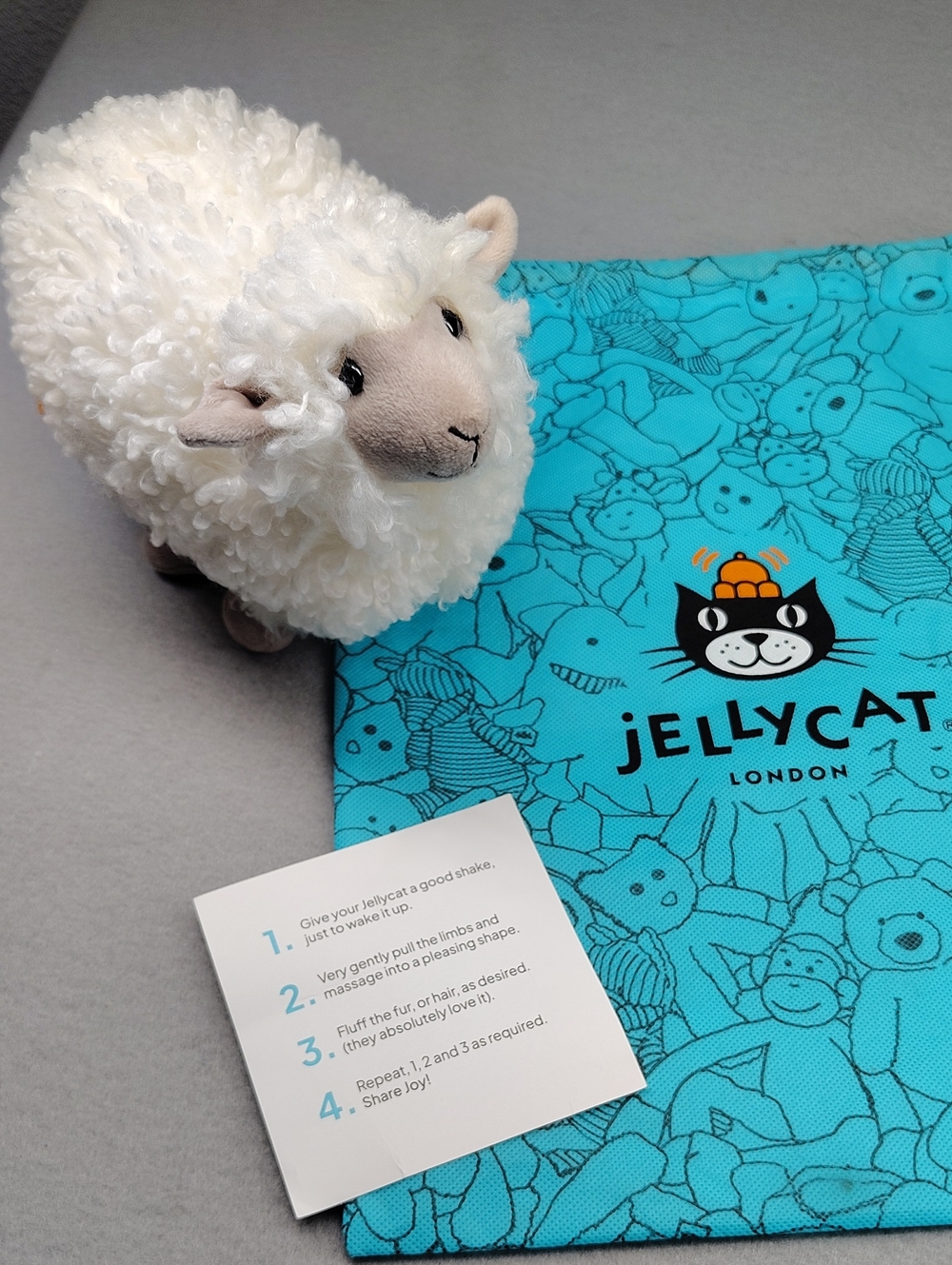 Jellycat Cream Curly Sheep Plush with Blue JellyCat Bag